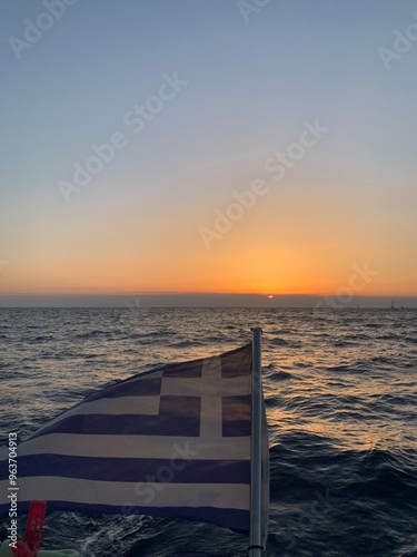 sunset over the sea Greek flag