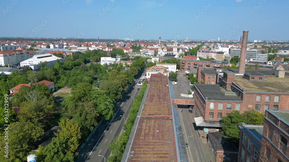 Leipzig spinning mill brick buildings chimney. Dramatic aerial view flight drone Leipzig spinning mill brick buildings chimney. Dramatic aerial view flight drone