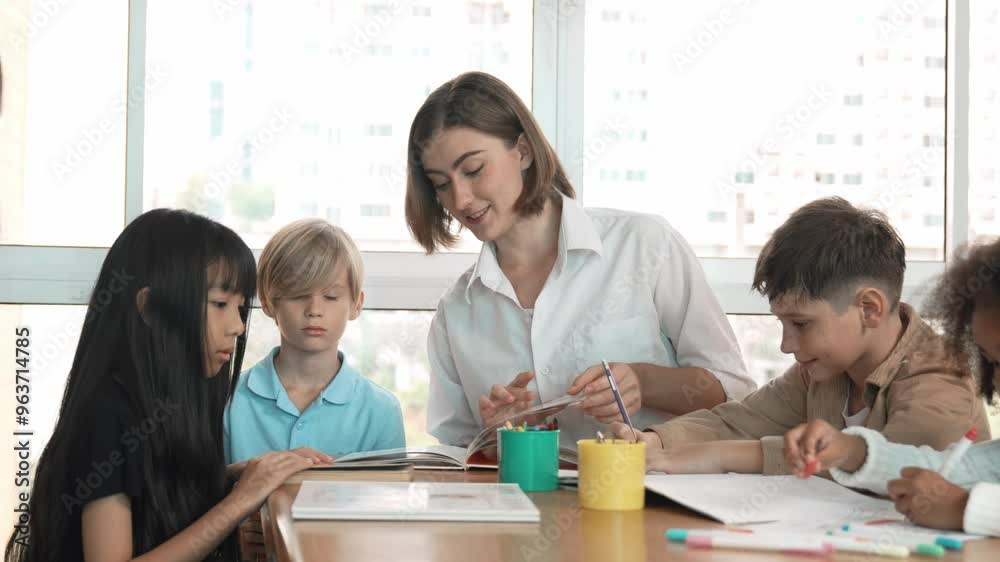Professional caucasian teacher telling story to diverse student while sitting at table with storybook and colored book. Smart learner listening story while colored picture from instructor. Erudition. Professional caucasian teacher telling story to diverse student while sitting at table with storybook and colored book. Smart learner listening story while colored picture from instructor. Erudition.