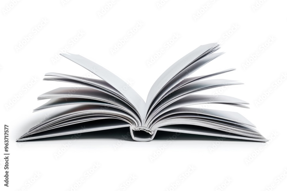 Obraz premium An open book on a white surface, perfect for academic or literary themed projects
