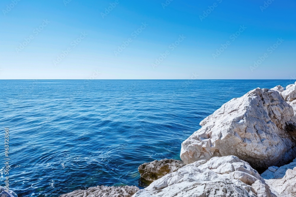 A scenic view of a rocky coastline with a calm ocean in the background, suitable for use in travel or nature-related content A scenic view of a rocky coastline with a calm ocean in the background, suitable for use in travel or nature-related content