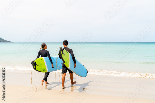 Photography Happy Asian family couple enjoy outdoor active lifestyle water sports surfing on summer holiday vacation