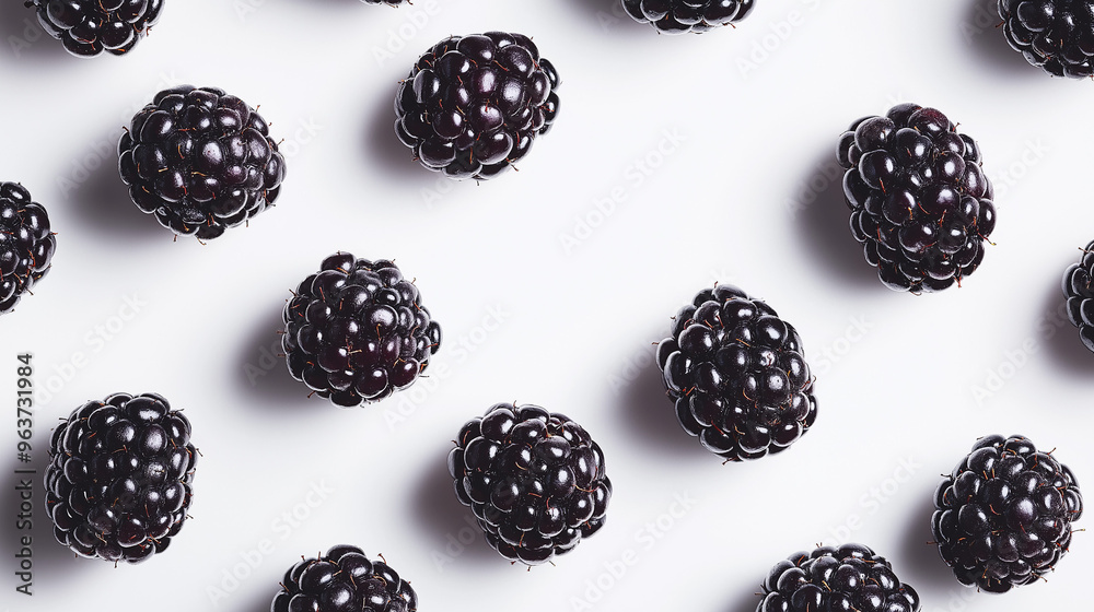 blackberries with rich dark color and natural dew against an isolated white background blackberries with rich dark color and natural dew against an isolated white background
