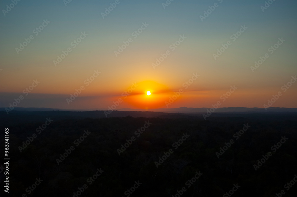 Sunset, panoramic view in the Guatemalan rainforest, relaxed and pollution-free space, Tikal National Park. Sunset, panoramic view in the Guatemalan rainforest, relaxed and pollution-free space, Tikal National Park.