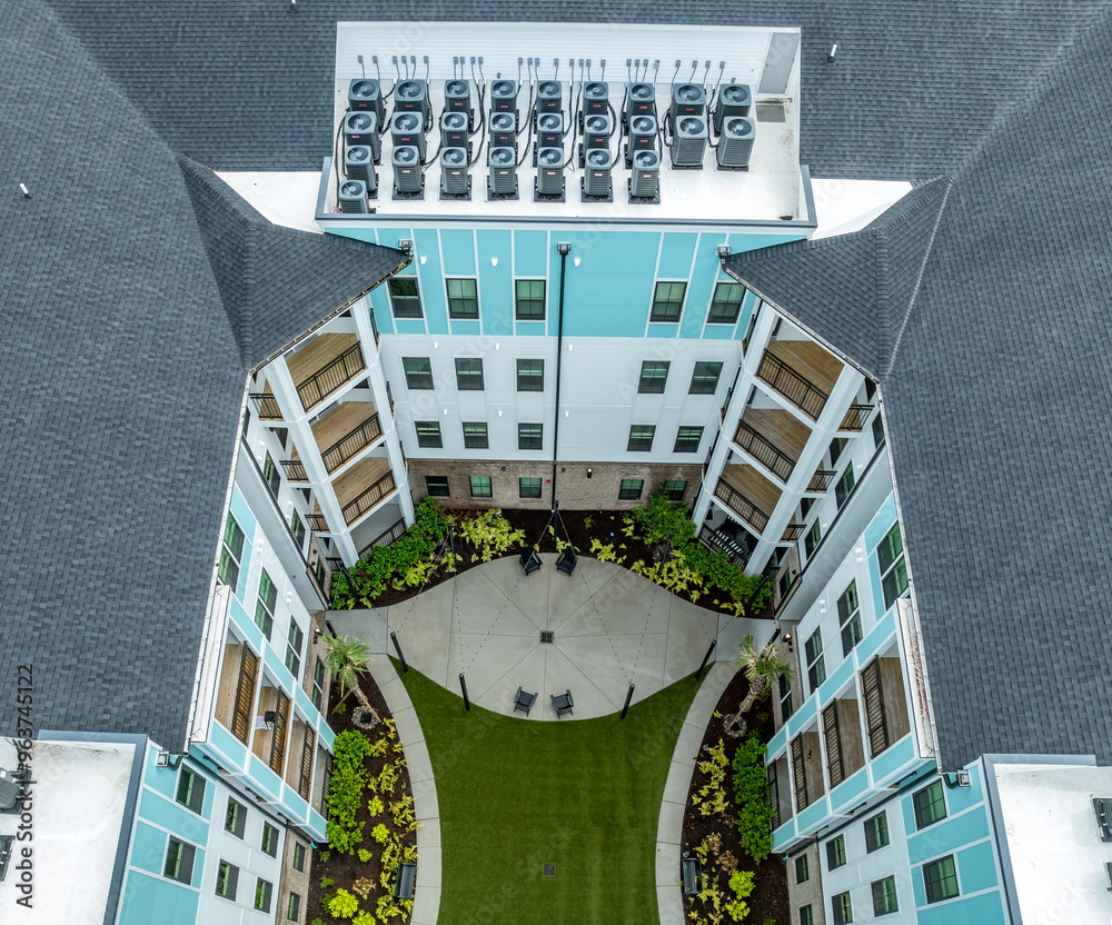 Aerial top down view of Rooftop Packaged Air Conditioner Furnace Units on American Condo complex at a new real estate development in South Carolina