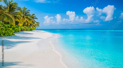 Fototapeta Naklejka Na Ścianę i Meble -  Tropical sea beach scene with clear turquoise water, white sandy shore and palm trees under a bright blue sky on a sunny day