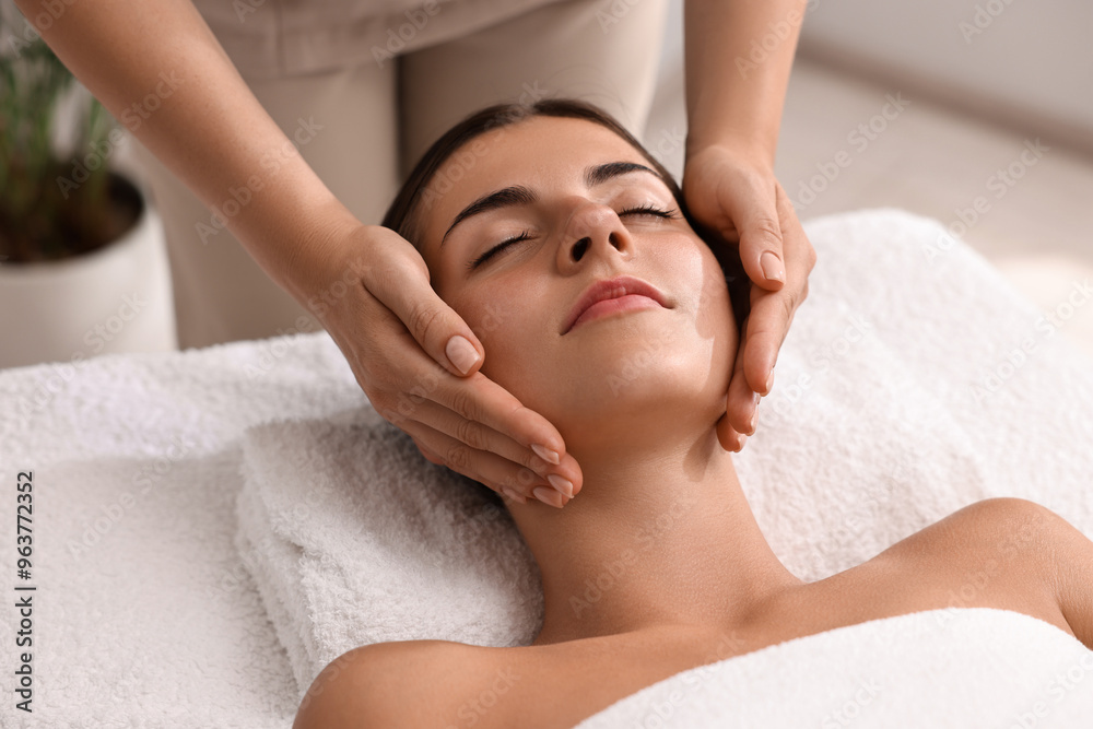 Attractive woman enjoying face massage, closeup. Beauty procedure Attractive woman enjoying face massage, closeup. Beauty procedure