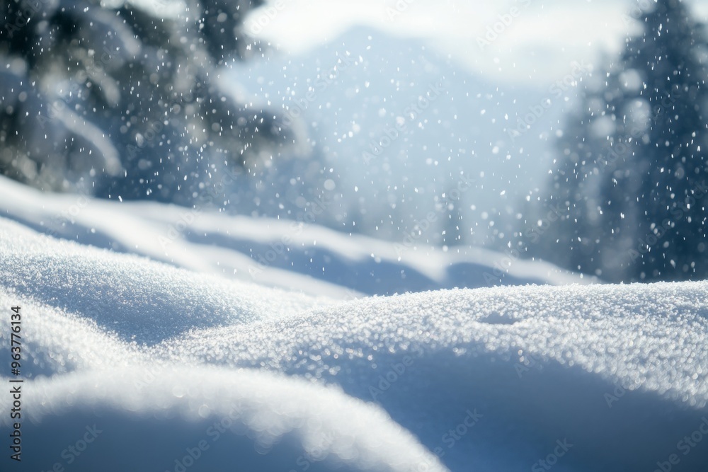 Fototapeta premium Snowy landscape with soft snowdrifts and gentle falling snow, set against a blurred background of winter trees and a cloudy sky