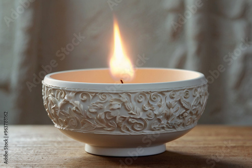 White Brazilian Candomblé Offering Bowl with Flame in Sacred Ritual Display photo