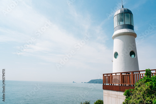 Haeundae Dongbaekseom island lighthouse in Busan, Korea photo