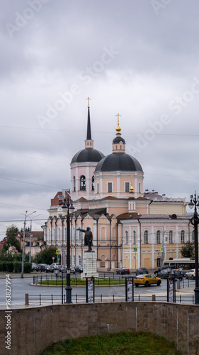 Photography A large church with a statue of a man in front of it