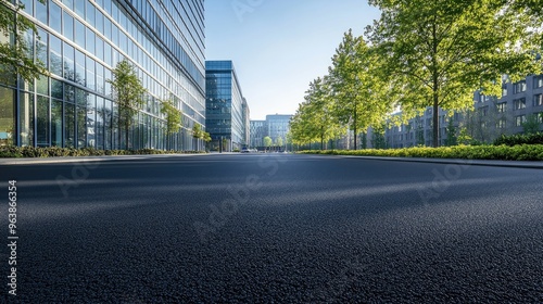 Empty asphalt road in a modern office area, highlighting urban development and corporate environments.