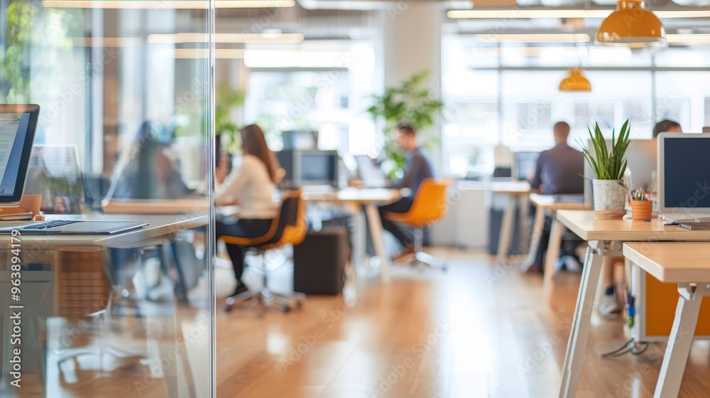 Modern Office Interior with Blurred Coworkers Glass Partition and Desk Modern Office Interior with Blurred Coworkers Glass Partition and Desk