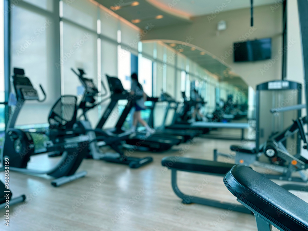 Running on Treadmill, Fitness Gym Exercise, walking on gym machine. Cardio walk. Athletic and muscular man training in modern gym. Runner training for marathon indoors, Defocus blur background Running on Treadmill, Fitness Gym Exercise, walking on gym machine. Cardio walk. Athletic and muscular man training in modern gym. Runner training for marathon indoors, Defocus blur background