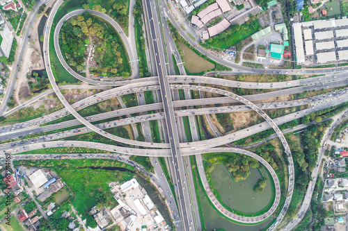 Aerial view transport junction road with green tree park car movement sunset light