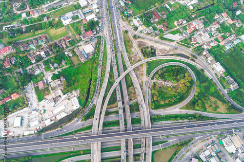 Aerial view transport junction road with green tree park car movement sunset light