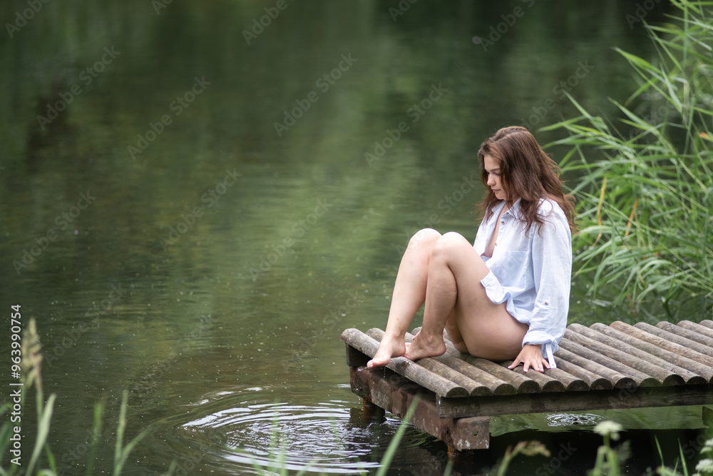 Beautiful young dark-haired girl by the river. Beautiful young dark-haired girl by the river.
