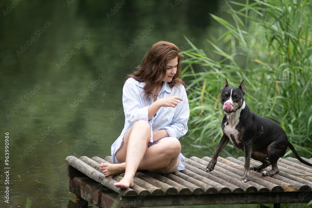 Beautiful young dark-haired girl by the river. Beautiful young dark-haired girl by the river.