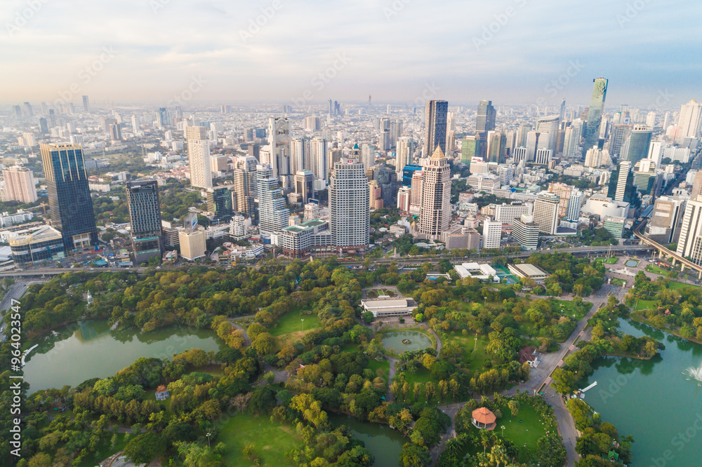 Obraz premium Aerial view modern city office building downtown of Bangkok with green public tropical park