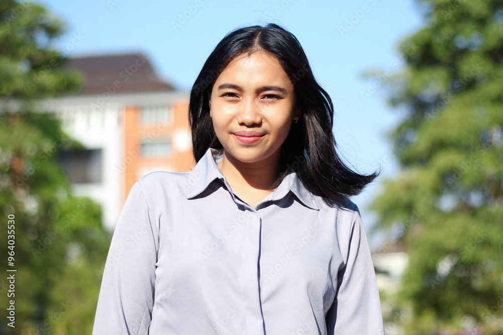 close up asian business woman smiling at camera wearing formal suit standing over city building and green plant background close up asian business woman smiling at camera wearing formal suit standing over city building and green plant background