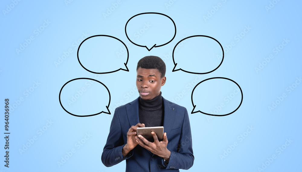 Person holding tablet with multiple empty speech bubbles on blue Person holding tablet with multiple empty speech bubbles on blue