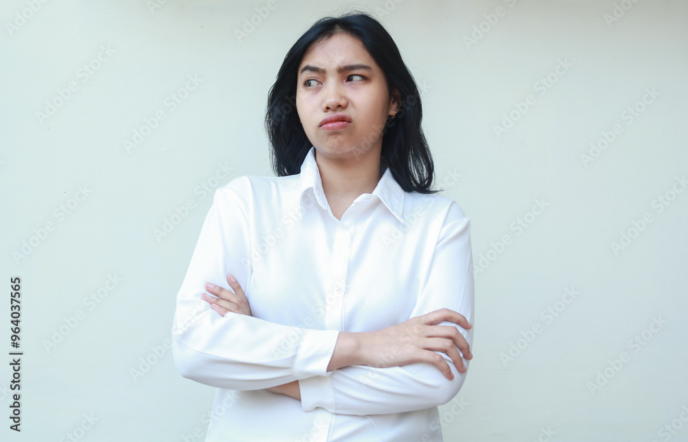 image of pensive asian business woman dressed in white formal suit shirt crossed hand folded arms look away nervous showing disbelief expression, standing thoughtful daydreaming