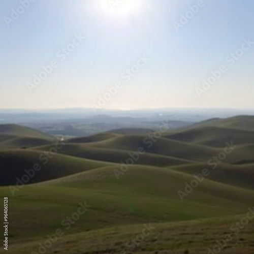 Rolling hills under bright sunlight with clear skies