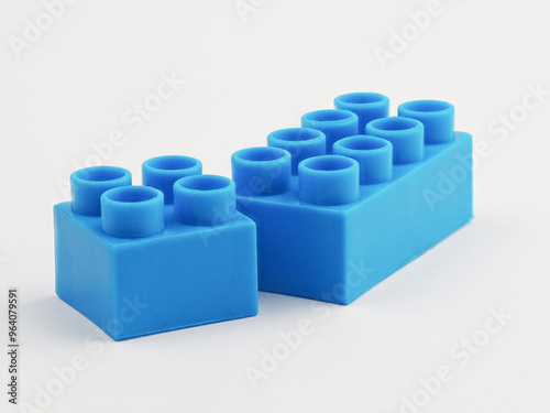 Fototapeta Naklejka Na Ścianę i Meble -  Blue Plastic Block on a White Background. Children Toy Brick, Perspective View. Close Up View of a Game Block for Constructors.