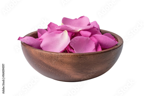 Delicate pink rose petals elegantly arranged in a wooden bowl, perfect for enhancing a tranquil setting or a romantic atmosphere.