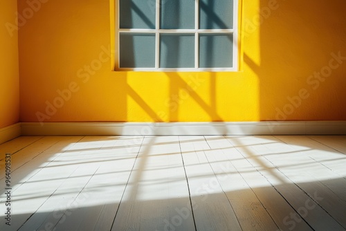 Sunshine casting shadows window on vibrant yellow wall