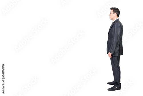 Serious male manager in suit standing in white studio photo