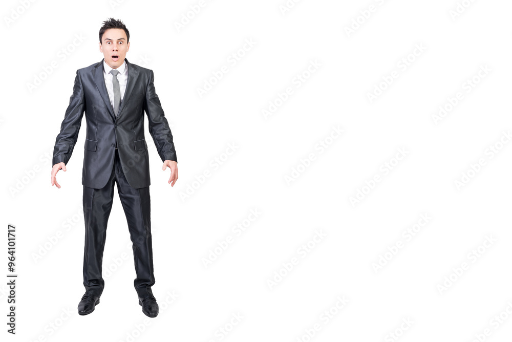 Astonished young businessman with opened mouth. White background.