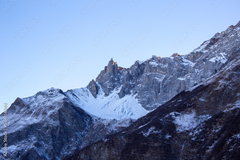 Fototapeta premium Mountain covered in the first snow of the year