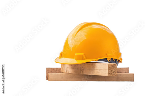 A yellow safety helmet placed on top of wooden planks, symbolizing construction and worker safety. photo