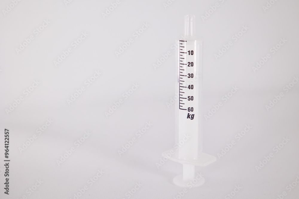 Medical syringe with kg as dosage indicator Medical syringe with kg as dosage indicator