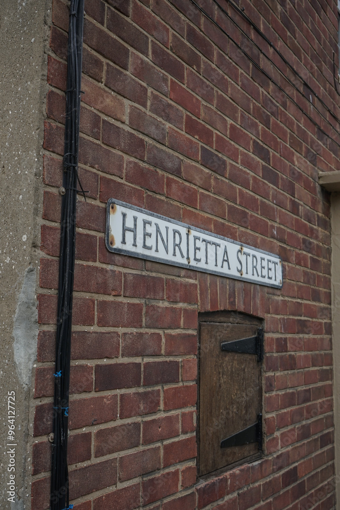 Obraz premium street sign on red brick background. seaside style cottage wall. 