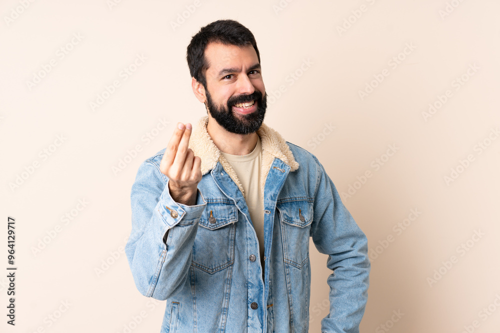 Caucasian man with beard over isolated background making money gesture Caucasian man with beard over isolated background making money gesture