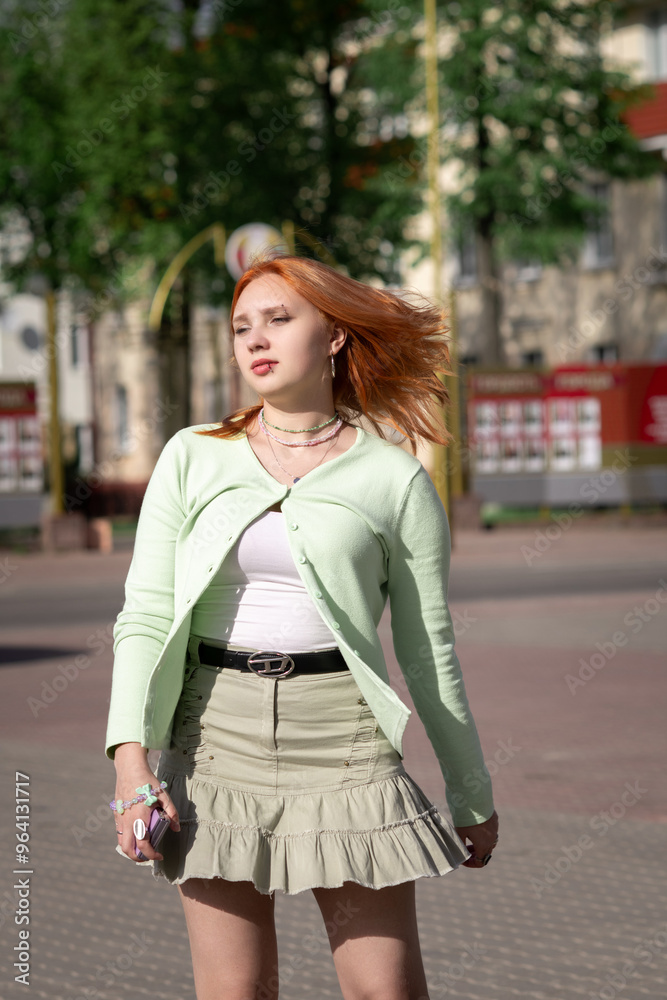 Portrait of a young beautiful blonde girl in an urban environment. Portrait of a young beautiful blonde girl in an urban environment.