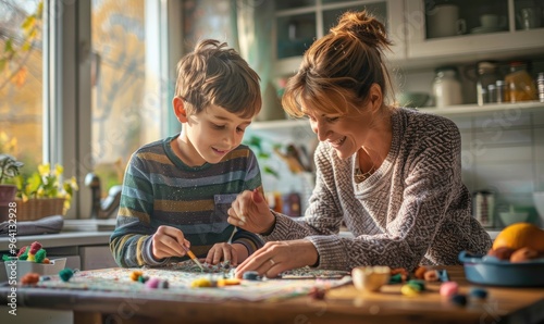 A mother and her young son enjoying a DIY art and craft project together in a cozy kitchen environment, illustrating family bonding and creativity during leisure time