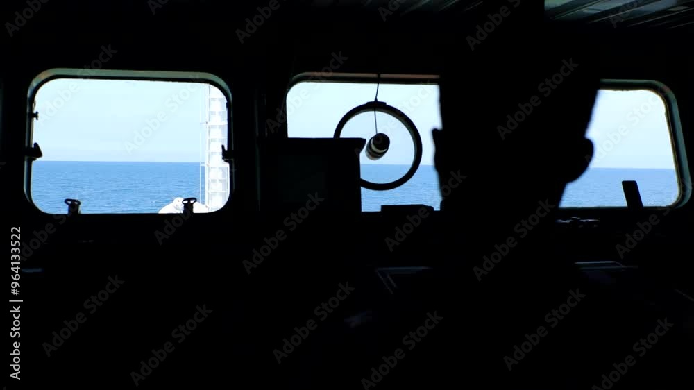 Minimalist captain silhouette steering, stunning ocean view. Minimalist captain silhouette steering, stunning ocean view.