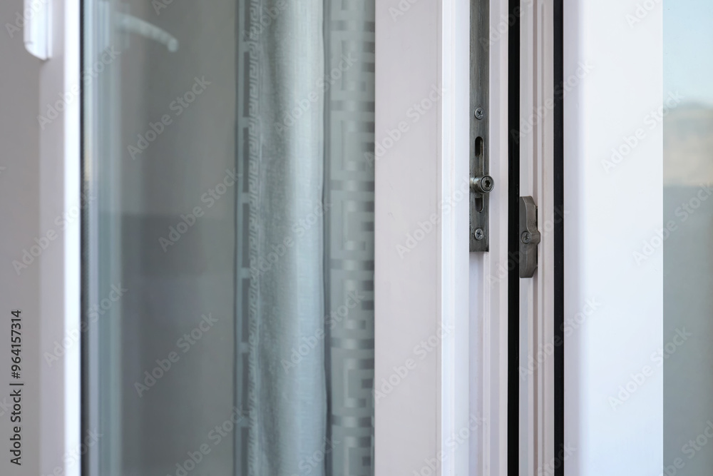 The lock mechanism of a metal-plastic window or door. The lock mechanism of a metal-plastic window or door.