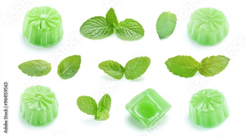 A collection of green candies with mint leaves. The candies are arranged in a row, with some of them being shaped like leaves. The candies are all green and appear to be made of a clear material photo