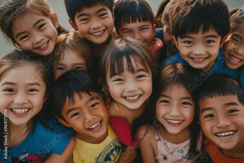 A group of children are smiling and posing for a picture