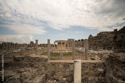 Obraz na płótnie Ancient apollo roman Ruins Under Dramatic Cloudy Sky in Turkey in the town of side w salonie