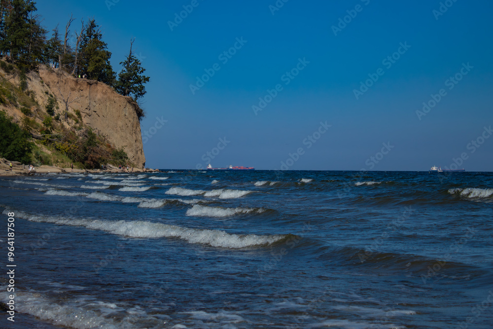 morning waves on the beach of the Baltic Sea with a view of lonely rocks morning waves on the beach of the Baltic Sea with a view of lonely rocks