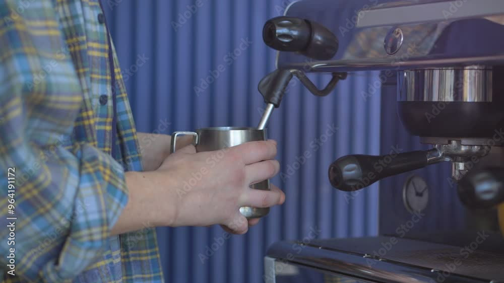 Unrecognizable barista preparing cup of coffee in coffee machine, close up. Process of making hot coffee in coffee shop. Unrecognizable barista preparing cup of coffee in coffee machine, close up. Process of making hot coffee in coffee shop.