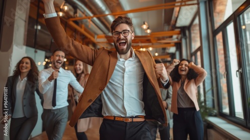 Ecstatic businessman leading team in joyful celebration