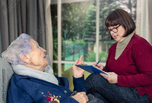 Nurturing Elder Well-being: Candid Moment Shows Social Worker's Vital Role in Amplifying Seniors' Voices and Needs.