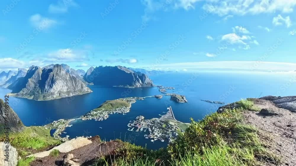 Timelapse with fast-moving clouds over the Reine village from Reinebringen mountain in Lofoten. Timelapse with fast-moving clouds over the Reine village from Reinebringen mountain in Lofoten.