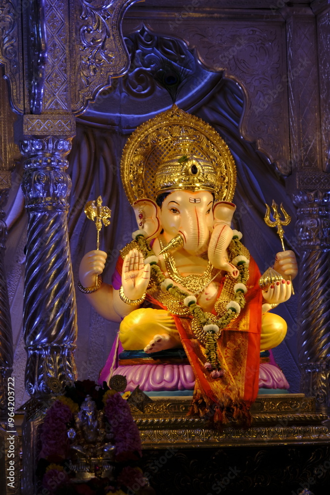 Fototapeta premium 07 September 2024, Pune, Maharashtra, India, Beautiful sculpture of Lord Ganesh called as Tambdi Jogeshwari Ganpati near ABC chowk, Pune, during Ganesh Utsav Festival 2024.